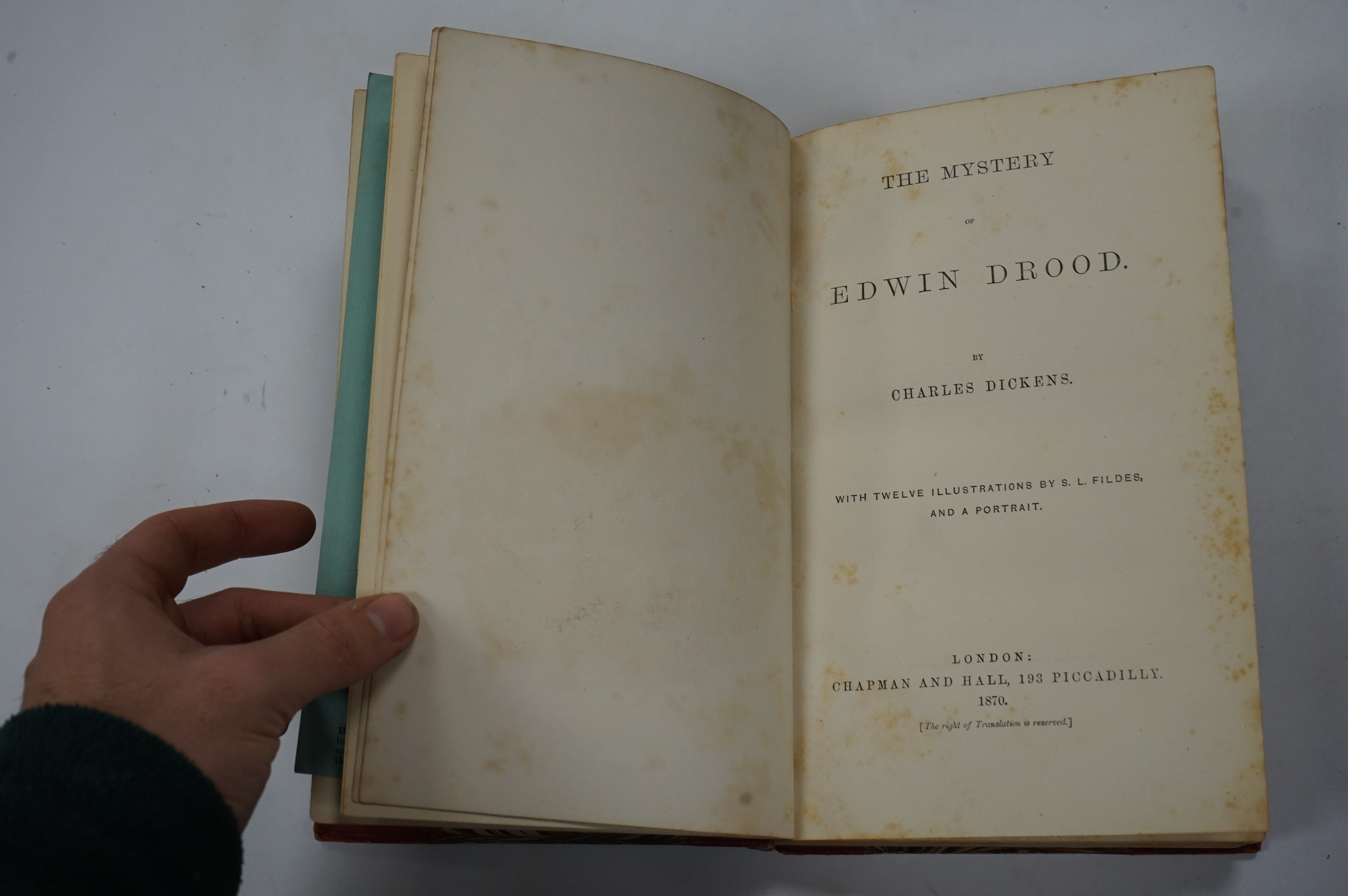 Dickens, Charles - The Mystery of Edwin Drood. First Edition. portrait (of the author), pictorial engraved and printed titles, and 12 plates (by S.L. Fildes); old calf and marbled boards, gilt decorated panelled spine wi